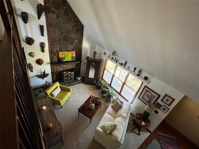 interior space featuring lofted ceiling and a fireplace