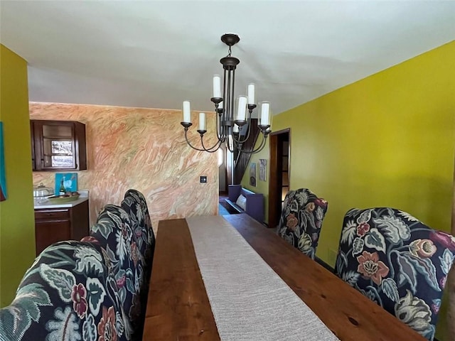 dining space with a chandelier