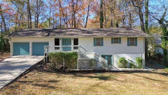 view of front of home featuring a front yard, a porch, an attached garage, stairs, and concrete driveway