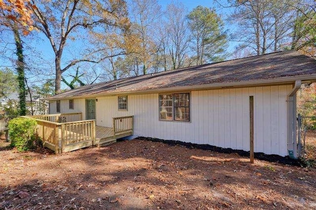 back of property featuring a deck