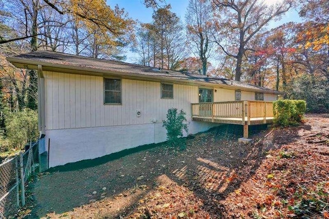 back of property featuring fence