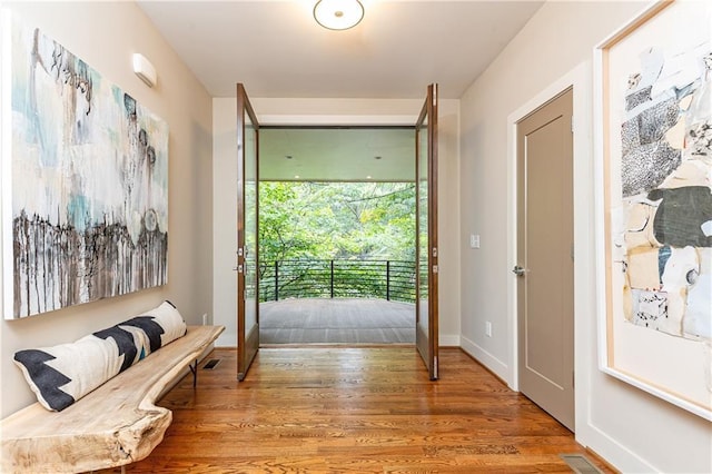 doorway to outside featuring hardwood / wood-style flooring