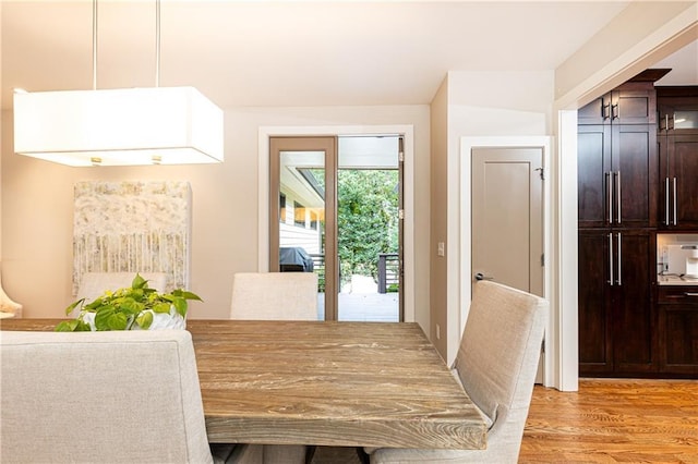 dining area with light hardwood / wood-style floors