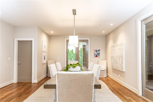 dining space featuring hardwood / wood-style floors