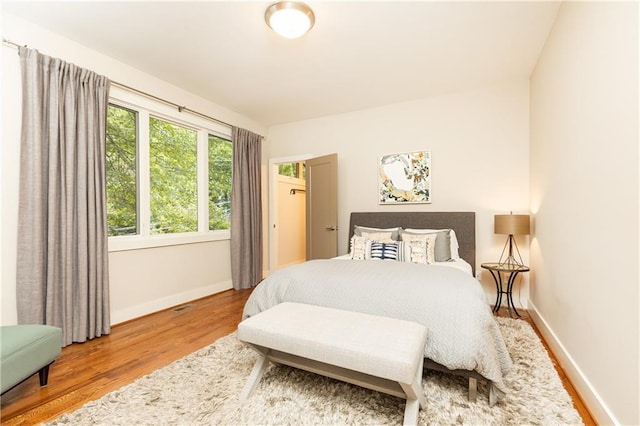 bedroom with wood-type flooring