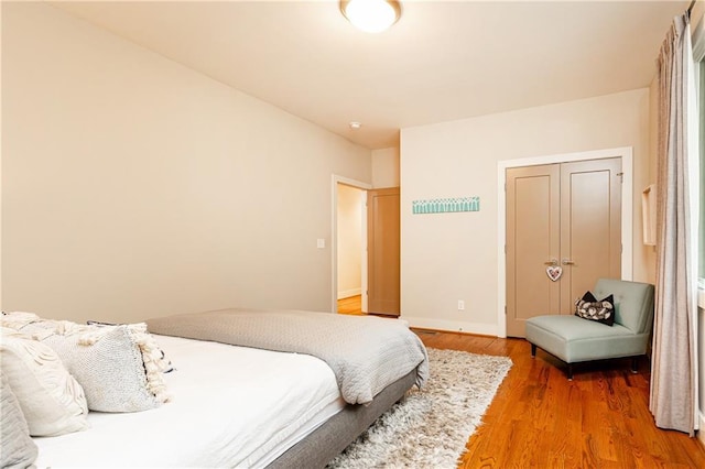 bedroom featuring a closet and wood-type flooring