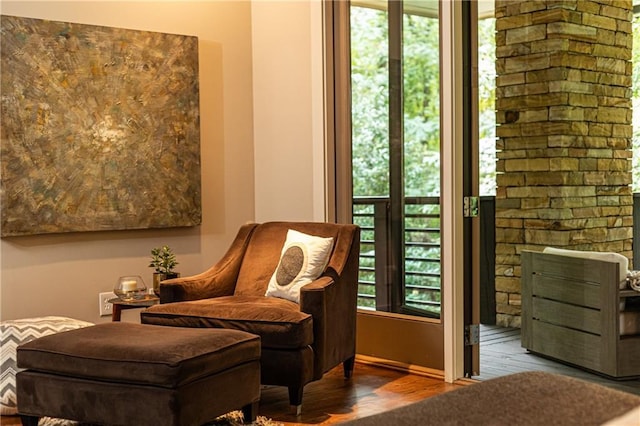 living area with hardwood / wood-style flooring