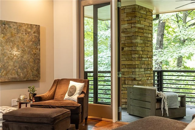 living area with hardwood / wood-style floors