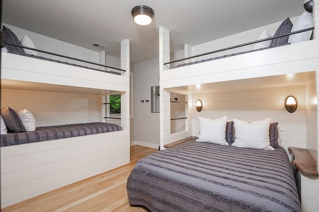 bedroom with wood-type flooring