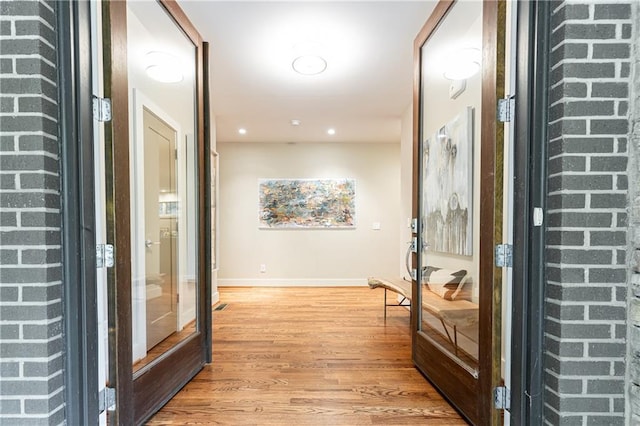 hallway featuring light wood-type flooring