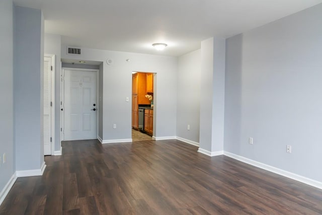 empty room featuring dark hardwood / wood-style flooring