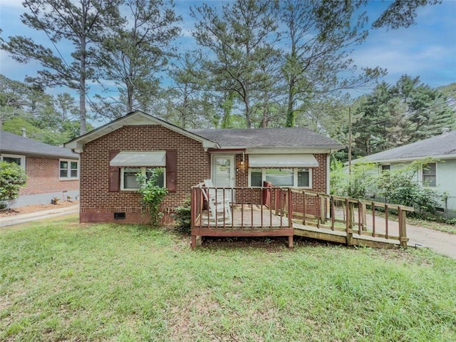 646 Quillian Ave, Decatur, GA 30032 - view of front of house with brick siding, crawl space, a wooden deck, and a front lawn