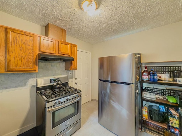 646 Quillian Ave, Decatur, GA 30032 - kitchen featuring under cabinet range hood, brown cabinets, a textured ceiling, and appliances with stainless steel finishes