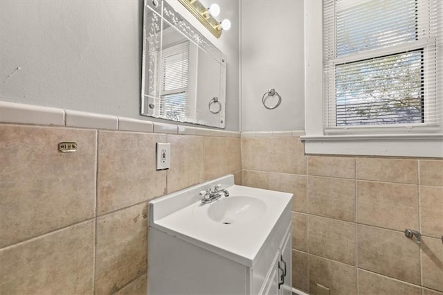 bathroom featuring tile walls and vanity