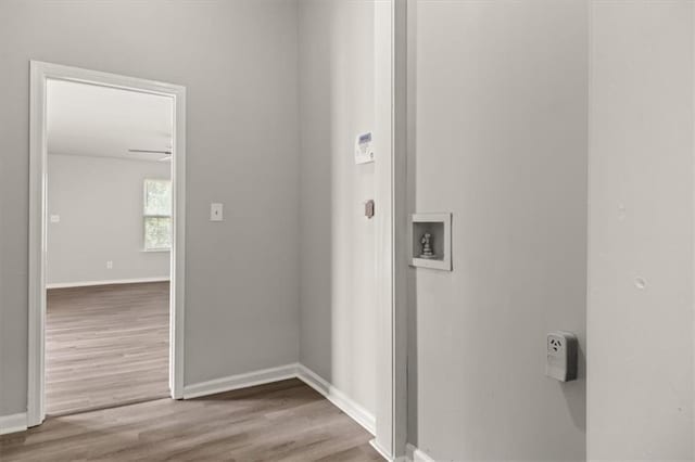 washroom with hookup for a washing machine, hookup for an electric dryer, ceiling fan, and hardwood / wood-style flooring