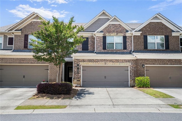 11686 Davenport Ln, Alpharetta, GA 30005 - view of front of house featuring brick siding, a garage, and driveway