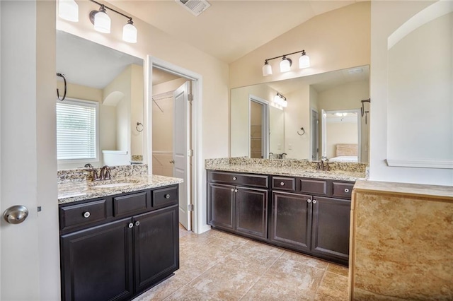 11686 Davenport Ln, Alpharetta, GA 30005 - bathroom featuring lofted ceiling, two vanities, and tile patterned flooring