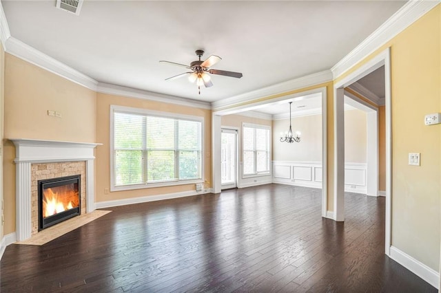 11686 Davenport Ln, Alpharetta, GA 30005 - unfurnished living room with a chandelier, a stone fireplace, a ceiling fan, dark wood-style floors, and ornamental molding