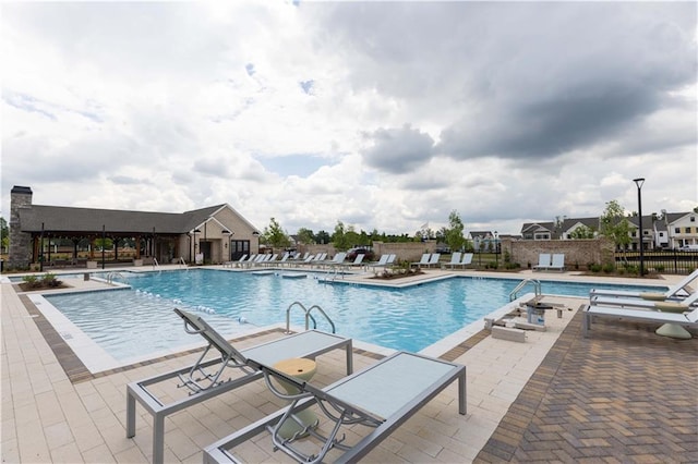 5440 Howington Ct Unit 190, Buford, GA 30518 - community pool featuring a patio area