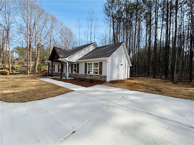 view of front of house with a porch and stone siding