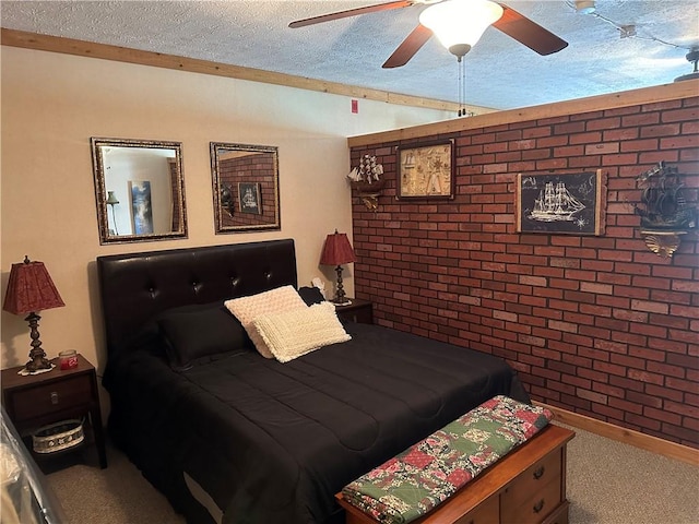 bedroom featuring carpet flooring, a textured ceiling, ceiling fan, and brick wall