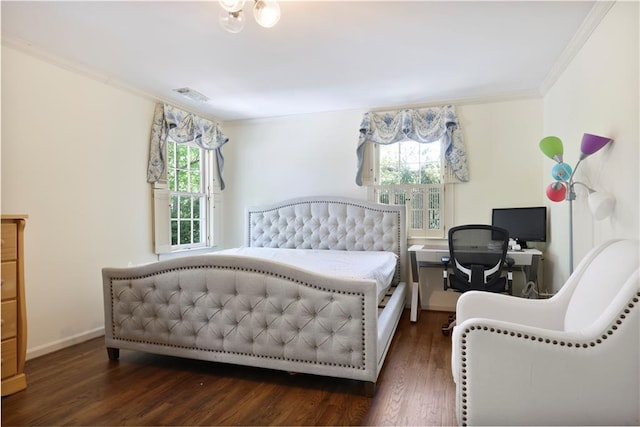 bedroom featuring multiple windows, visible vents, and crown molding