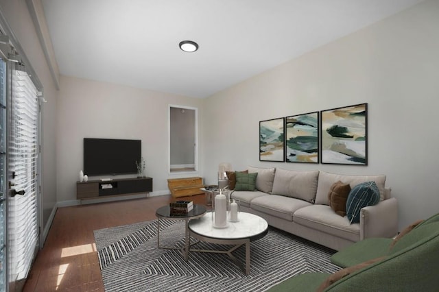 living room with baseboards and dark wood-type flooring