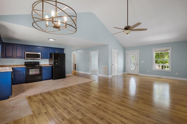 kitchen with open floor plan, light countertops, blue cabinetry, and black appliances