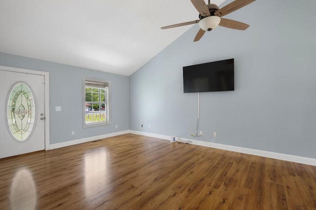 unfurnished living room featuring a ceiling fan, baseboards, and wood finished floors