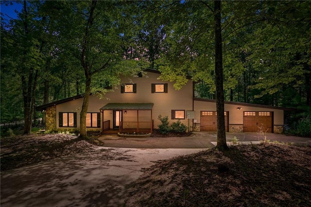 view of front facade featuring a garage and covered porch