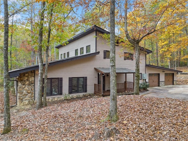 modern home with a garage and an outbuilding