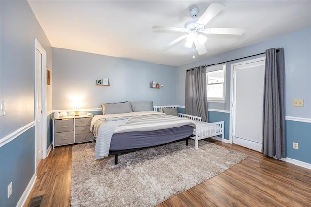 bedroom with wood-type flooring and ceiling fan