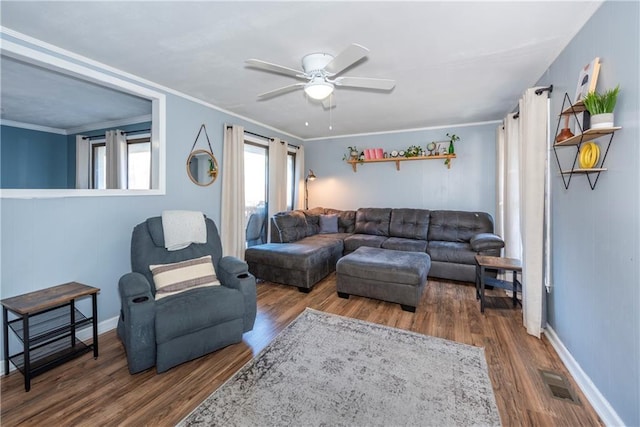 living room with crown molding, hardwood / wood-style flooring, and ceiling fan