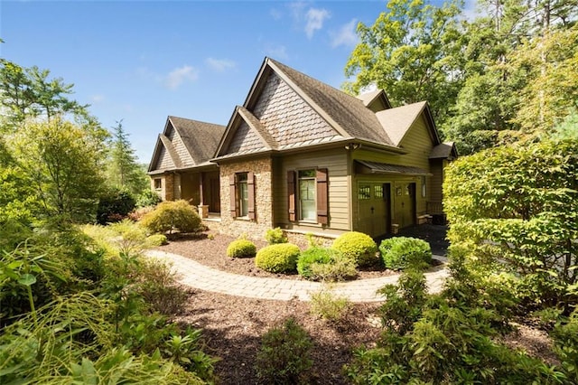 view of side of property featuring a garage