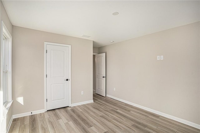 unfurnished bedroom featuring light hardwood / wood-style flooring