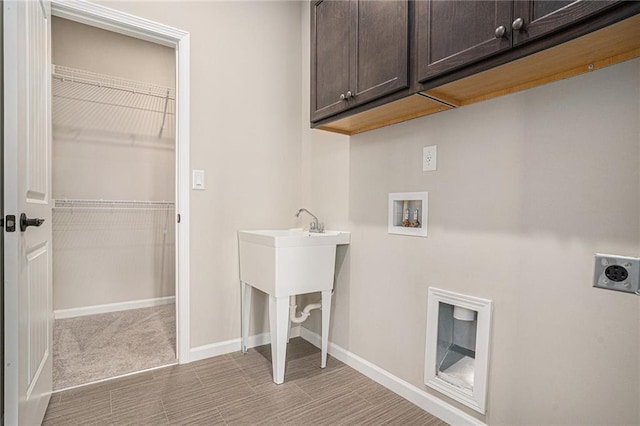 laundry area featuring washer hookup, light carpet, cabinets, and hookup for an electric dryer