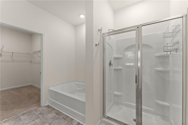 1278 Daurian Dr, Statham, GA 30666 - full bath with a garden tub, a shower stall, and a walk in closet