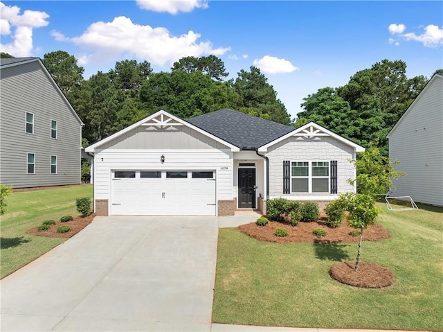 1278 Daurian Dr, Statham, GA 30666 - view of front facade with a front lawn, concrete driveway, an attached garage, and board and batten siding