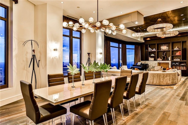 dining room featuring wood finished floors, visible vents, and recessed lighting