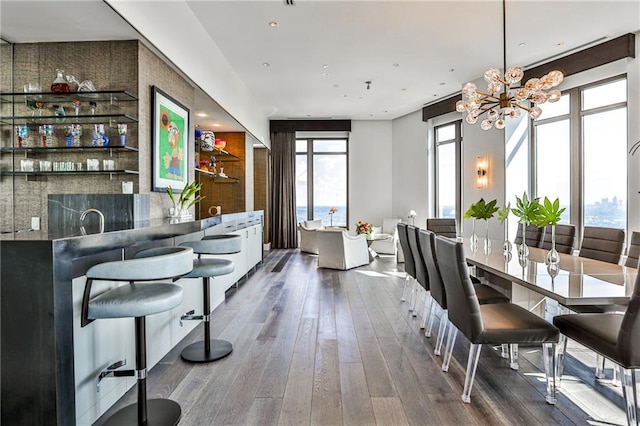 dining room featuring dark wood-style floors and a notable chandelier