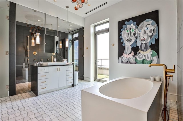 bathroom with a shower stall, visible vents, a bath, and vanity