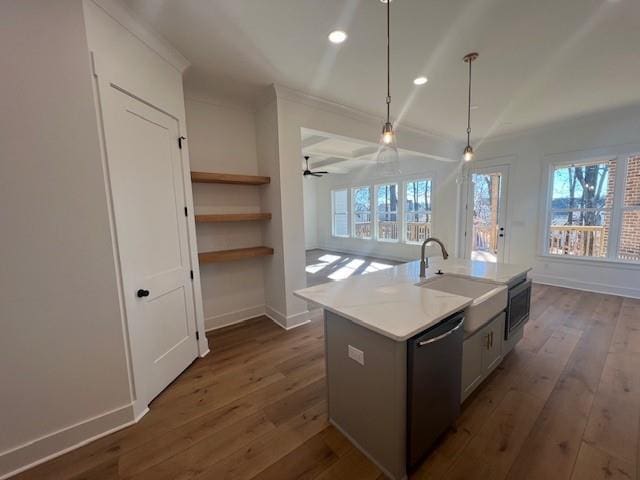 kitchen with ceiling fan, white cabinetry, an island with sink, decorative light fixtures, and appliances with stainless steel finishes