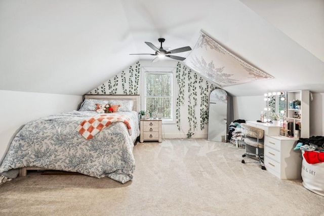 carpeted bedroom with ceiling fan and lofted ceiling