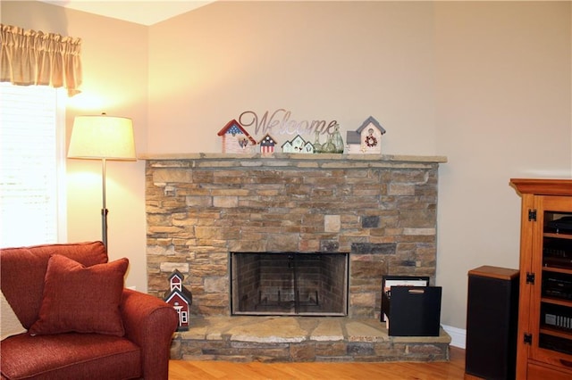 265 Mona Ct, Winder, GA 30680 - living area featuring wood finished floors and a stone fireplace