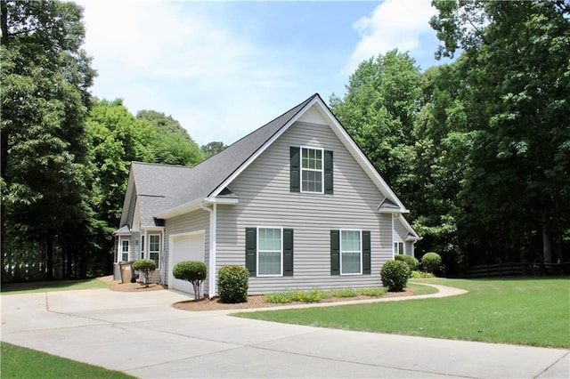 265 Mona Ct, Winder, GA 30680 - view of front facade featuring driveway, an attached garage, and a front lawn
