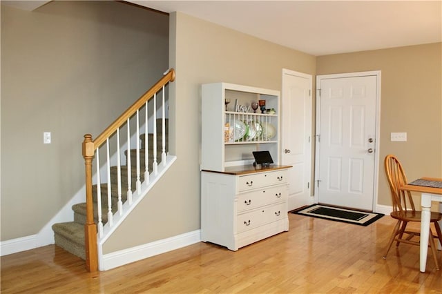 265 Mona Ct, Winder, GA 30680 - entryway with light wood-style floors, baseboards, and stairs