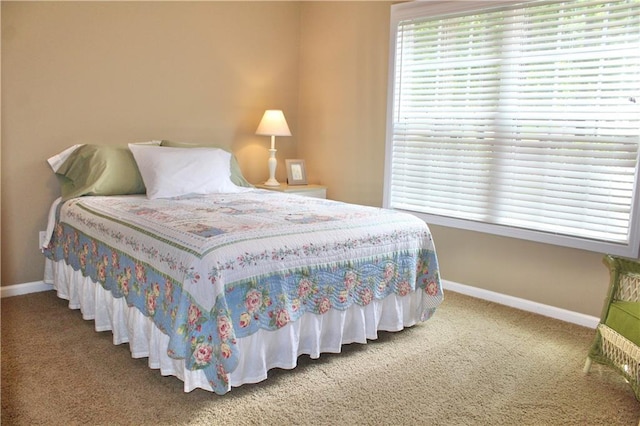 265 Mona Ct, Winder, GA 30680 - carpeted bedroom featuring baseboards