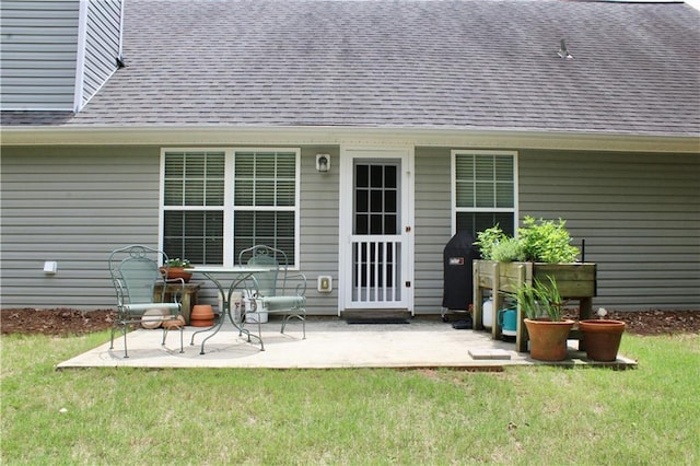 265 Mona Ct, Winder, GA 30680 - rear view of house featuring a shingled roof, a yard, and a patio area