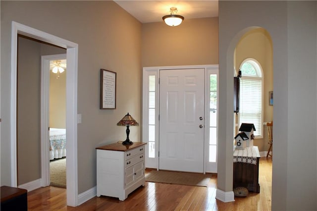265 Mona Ct, Winder, GA 30680 - entrance foyer featuring hardwood / wood-style flooring, arched walkways, baseboards, and ceiling fan