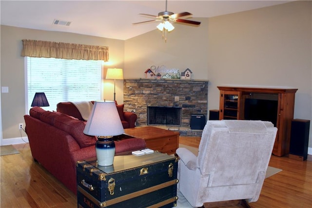 265 Mona Ct, Winder, GA 30680 - living room featuring wood finished floors, a ceiling fan, a fireplace, baseboards, and lofted ceiling